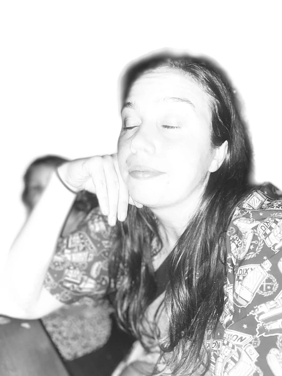 Jessikers resting her chin on her hand with her eyes closed