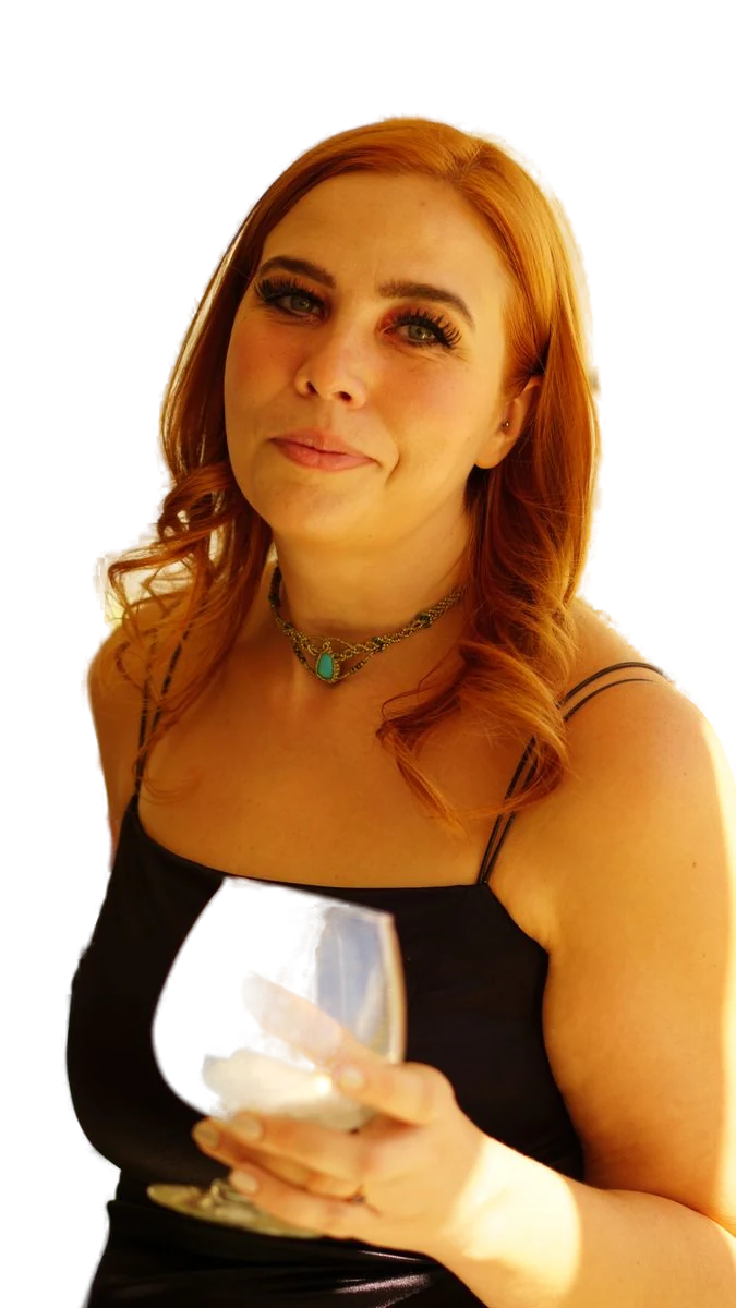 Jessikers dressed up and holding a wine glass
